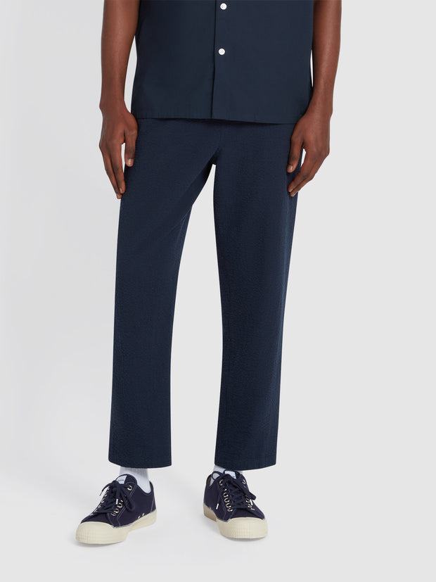 Hawtin Relaxed Tapered Fit Seersucker Trousers In True Navy